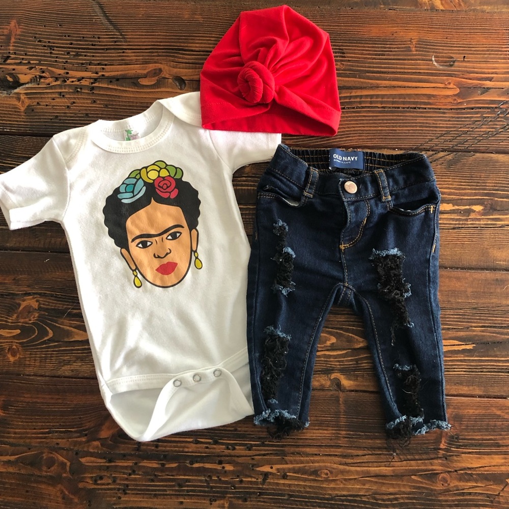Distressed jeans, bodysuit and hat.